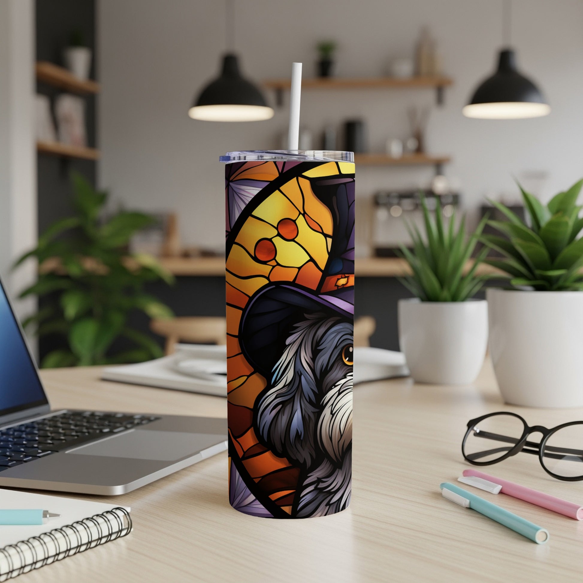 Stained glass dog with witch hat on a tumbler.