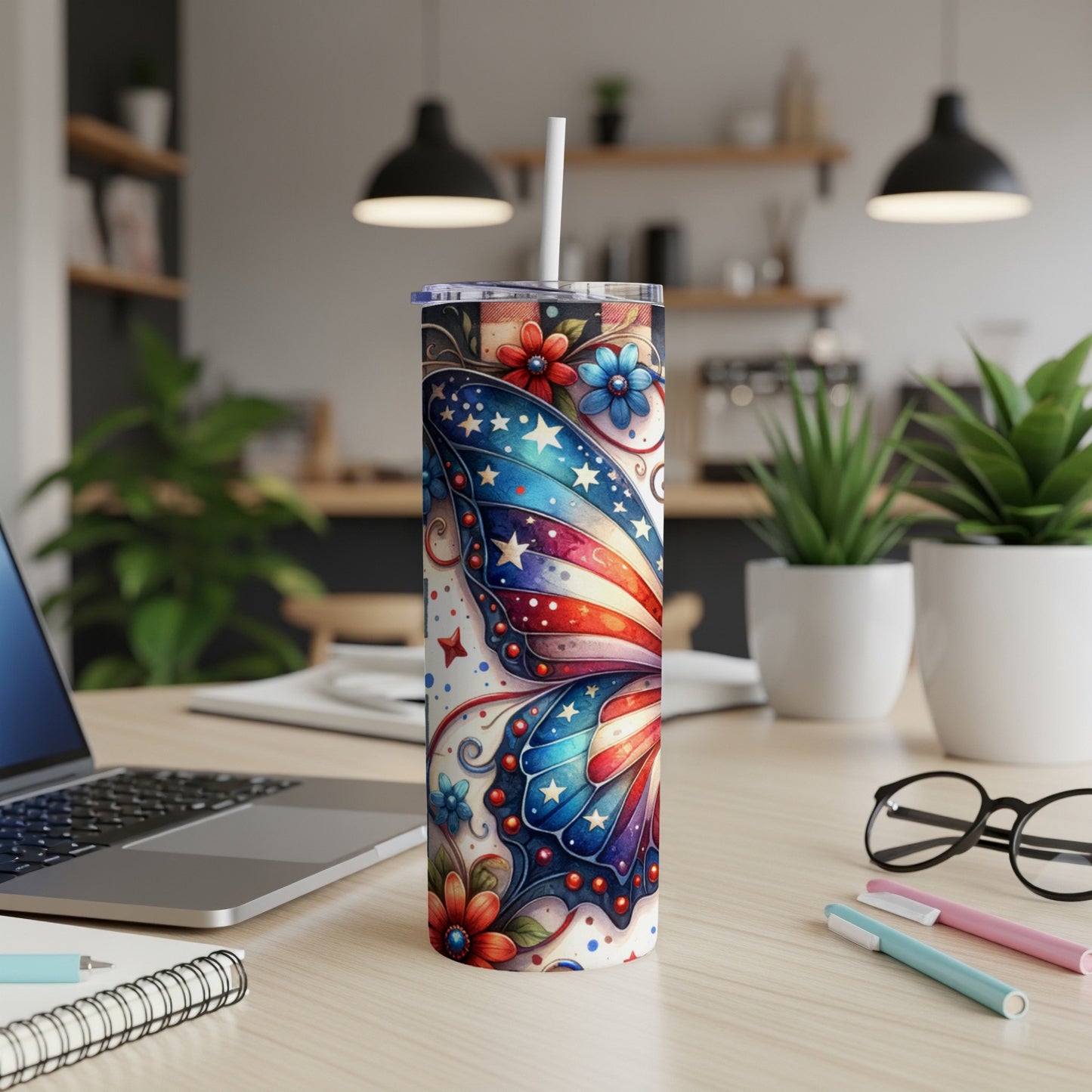 USA flag butterfly design on a skinny tumbler with straw.