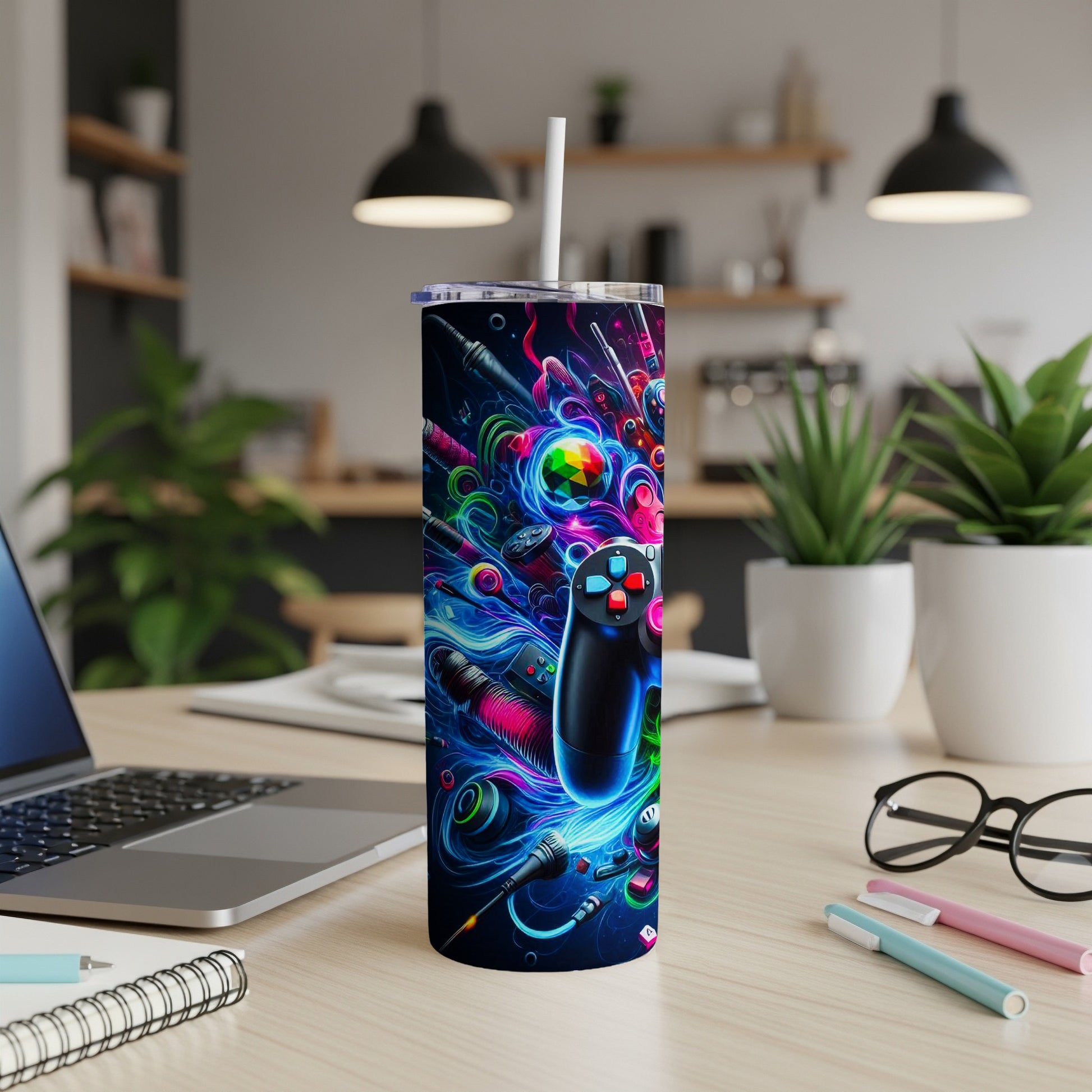 Neon gaming controller and abstract graphics on a tumbler with straw.