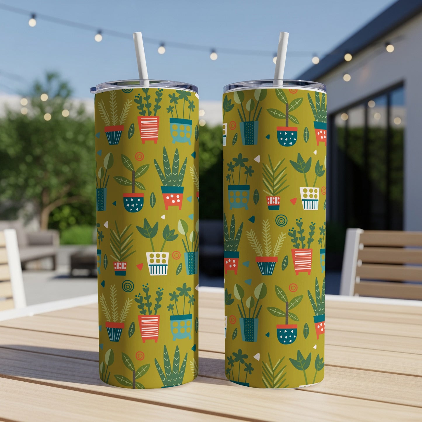 Two tumblers with a green background and a pattern of stylized potted plants.