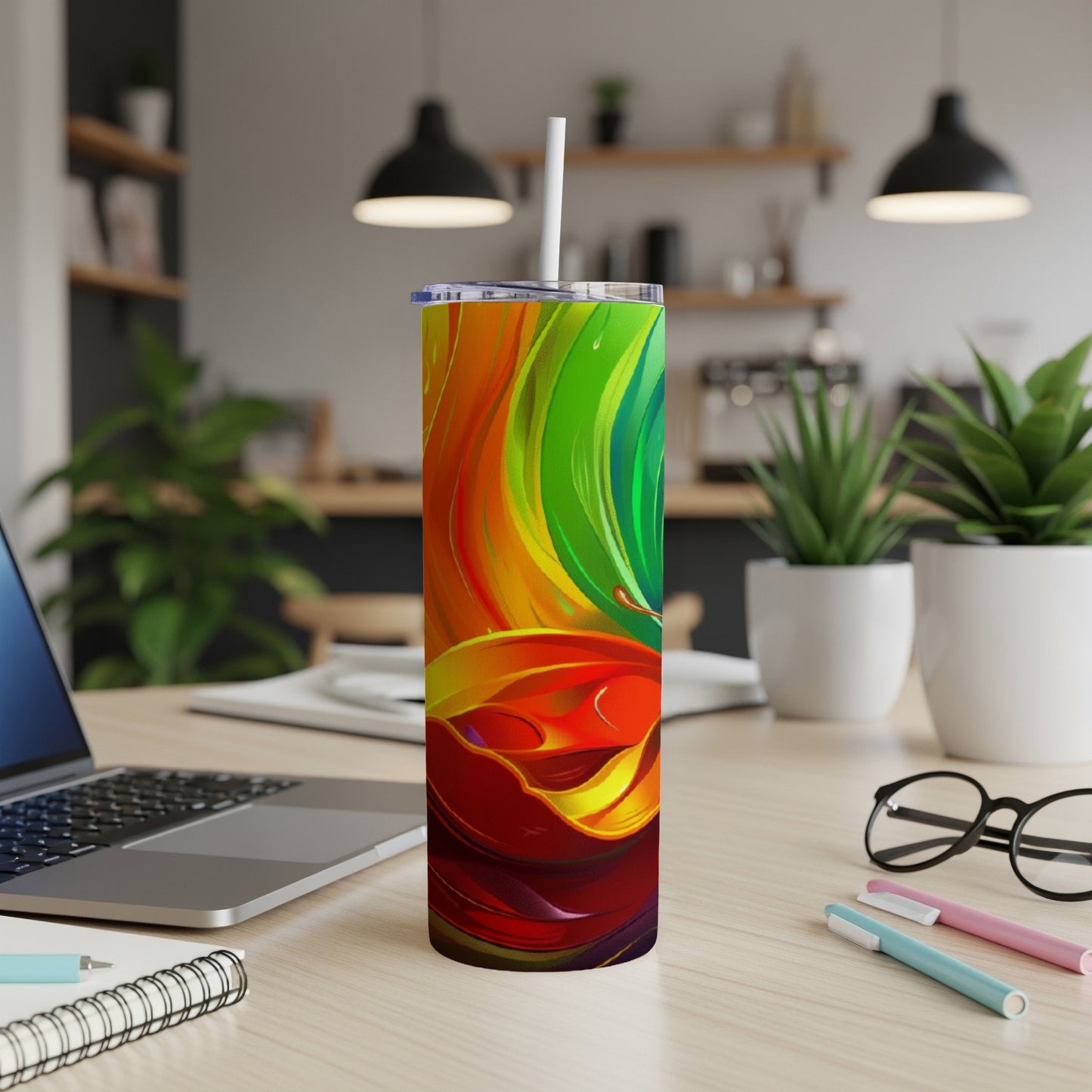 Rainbow-colored swirl pattern on a tall, slender tumbler with a straw.
