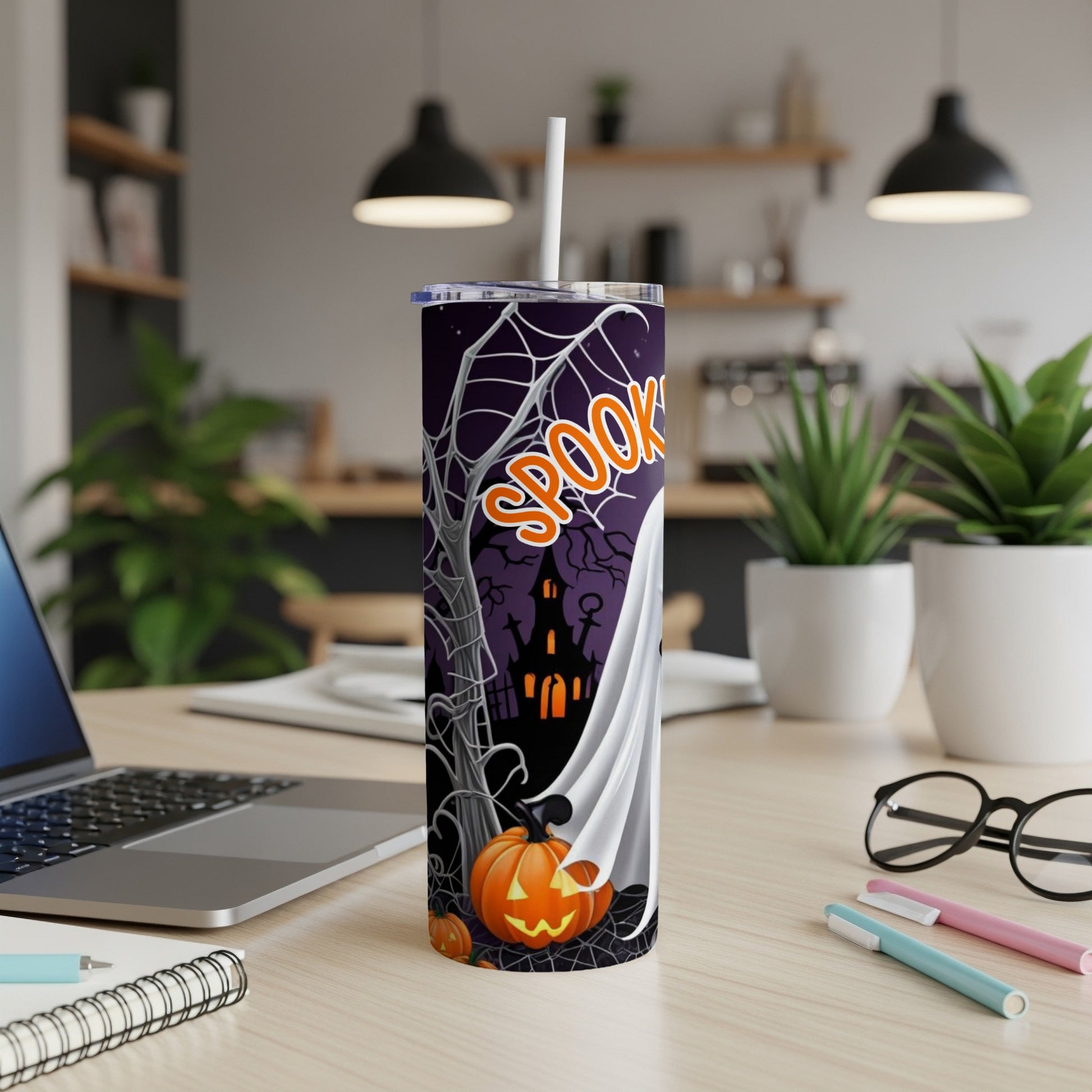 Halloween tumbler with ghost, pumpkin, spooky house, and "SPOOKY" text.