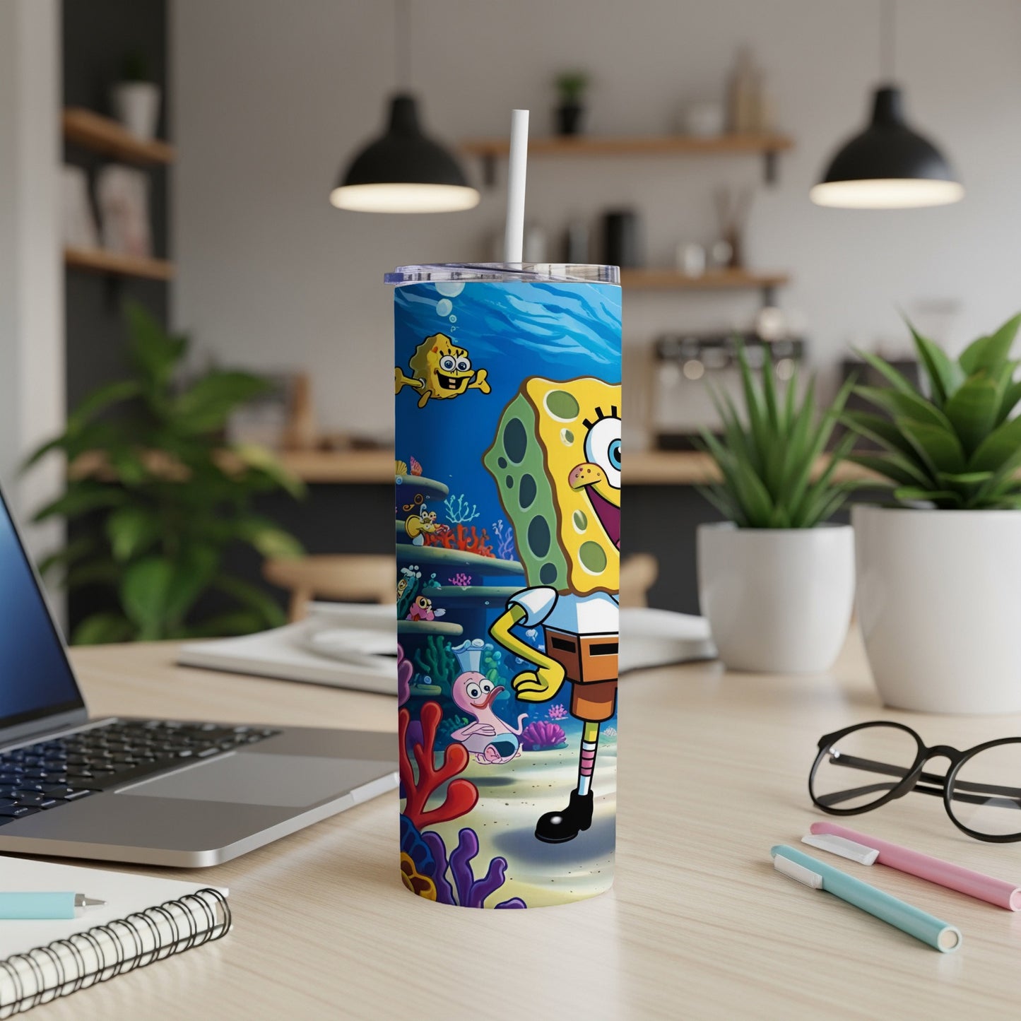 SpongeBob SquarePants character artwork on a blue and coral patterned tumbler.