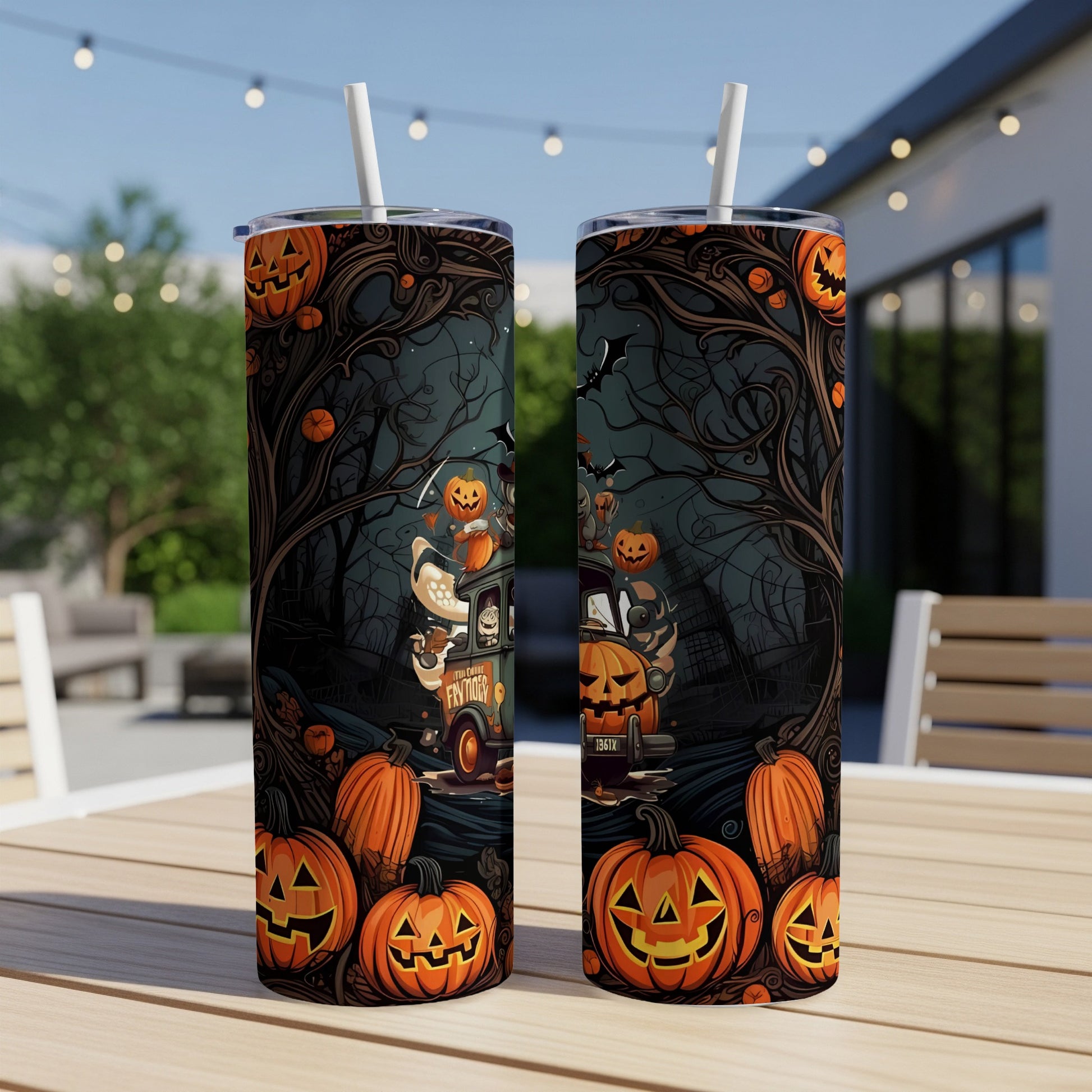 Two Halloween-themed tumblers with jack-o'-lanterns and spooky forest designs.
