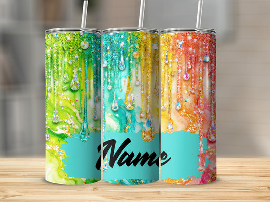 Three tumblers with colorful marbled designs and gemstone drips.