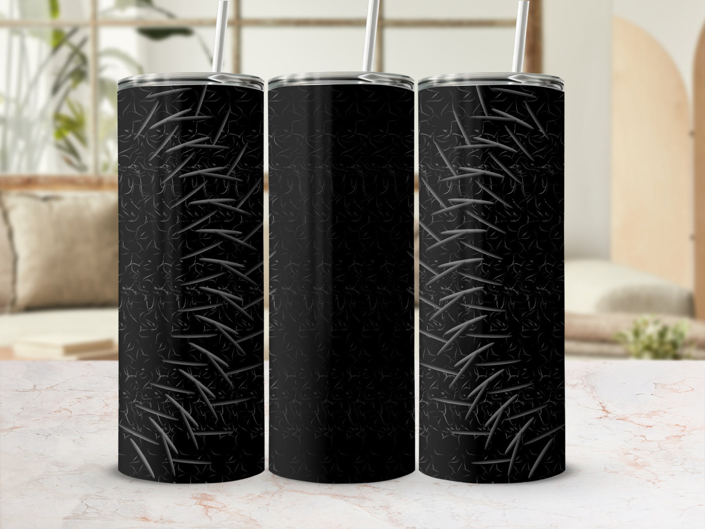 Black stainless steel tumbler with diamond plate pattern and straw.