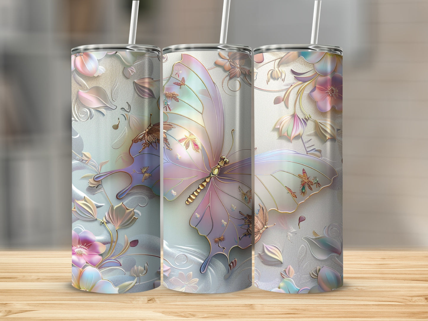 Three tumblers with iridescent butterfly and floral designs.