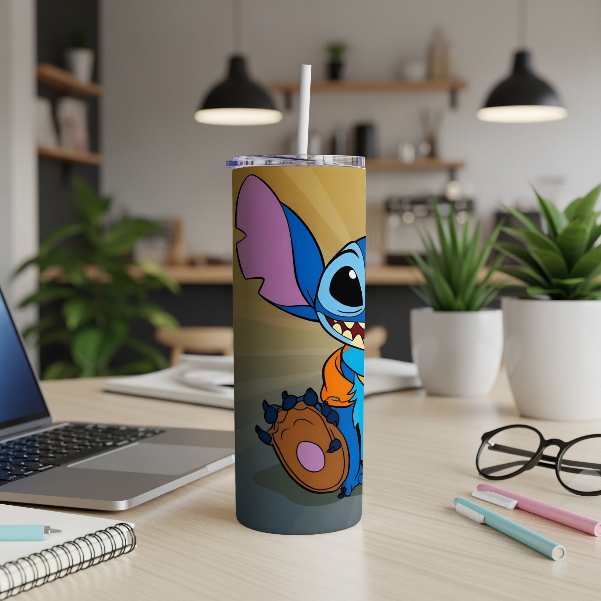Stitch character on a gold and orange gradient tumbler with a straw.