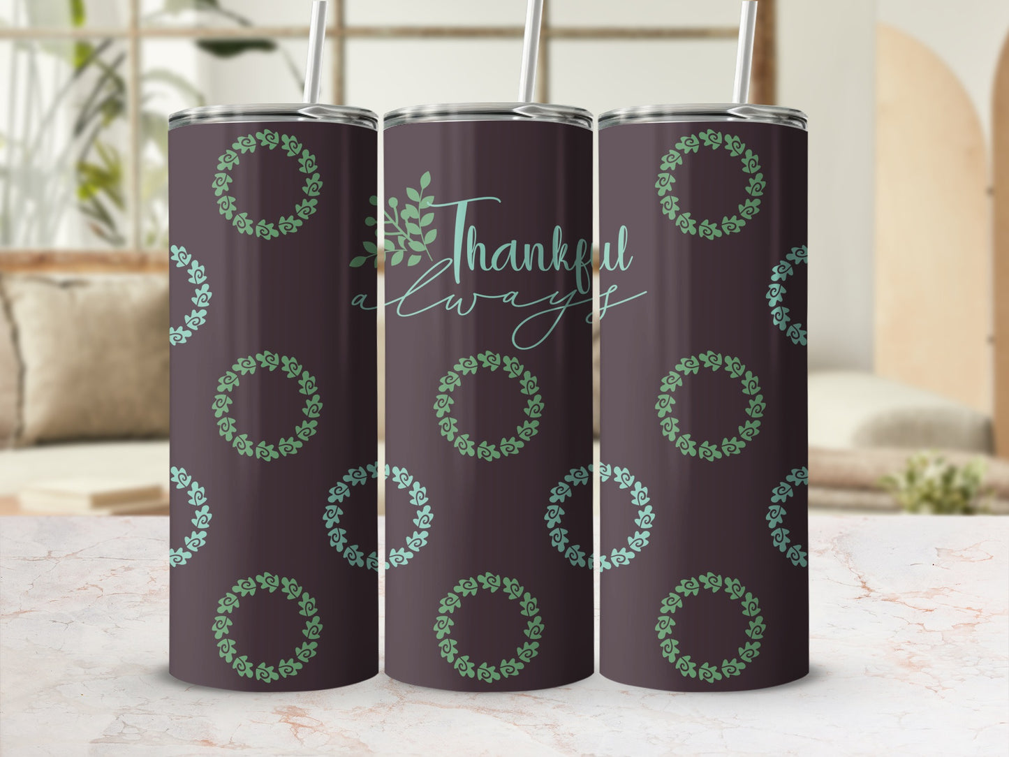 Dark tumbler with "Thankful Always" and green wreath pattern.