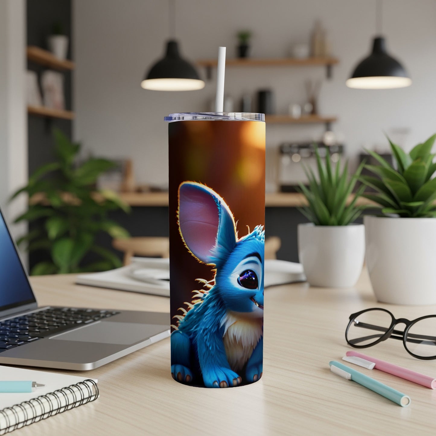 Blue cartoon creature with large ears and glowing eyes on a tumbler.