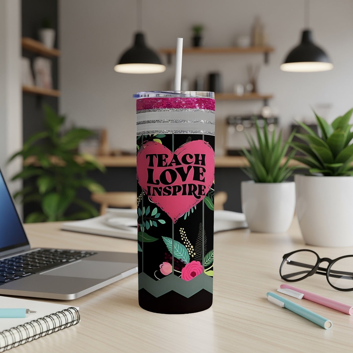 Black tumbler with pink heart and floral design, "TEACH LOVE INSPIRE" text.
