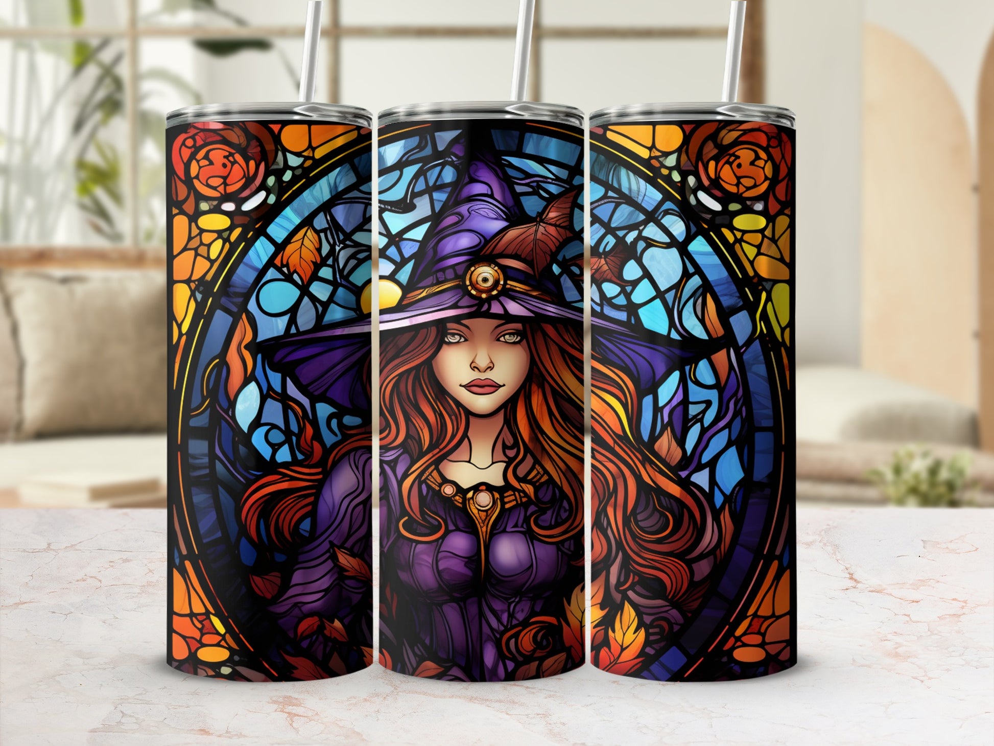 Stained glass witch with colorful autumnal accents on three tumblers.