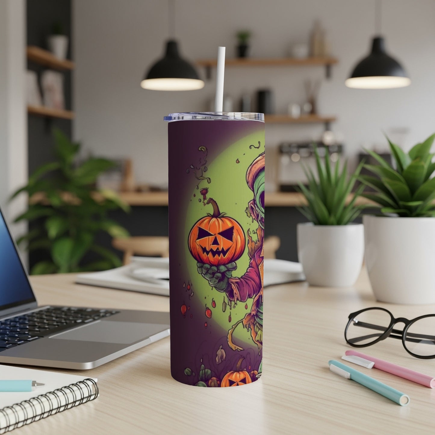 Tall tumbler with a spooky zombie and pumpkin Halloween design.