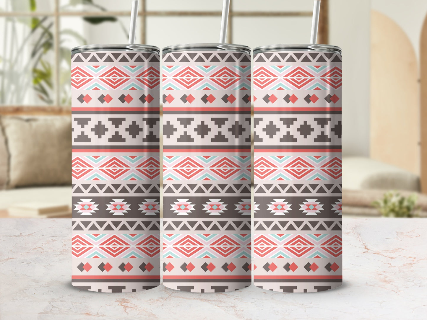 Three tumblers with a geometric Native American-inspired pattern in coral, mint, and brown.