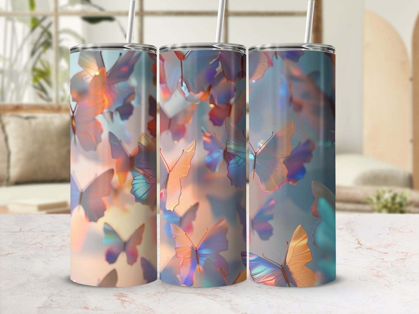 Three tumblers with iridescent butterfly patterns in a soft, blurred background.