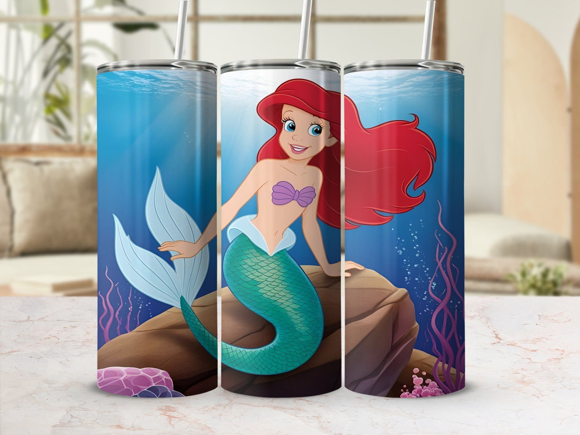 Ariel the mermaid on a rock with bubbles and seaweed.