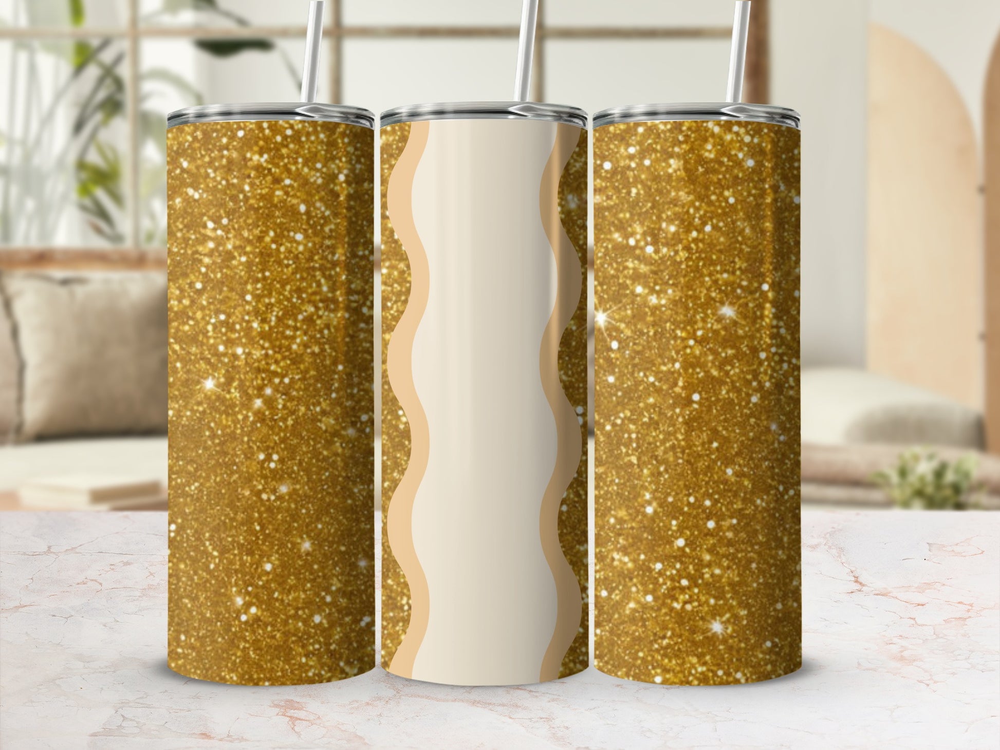 Three tumblers with gold glitter and a cream wavy pattern.