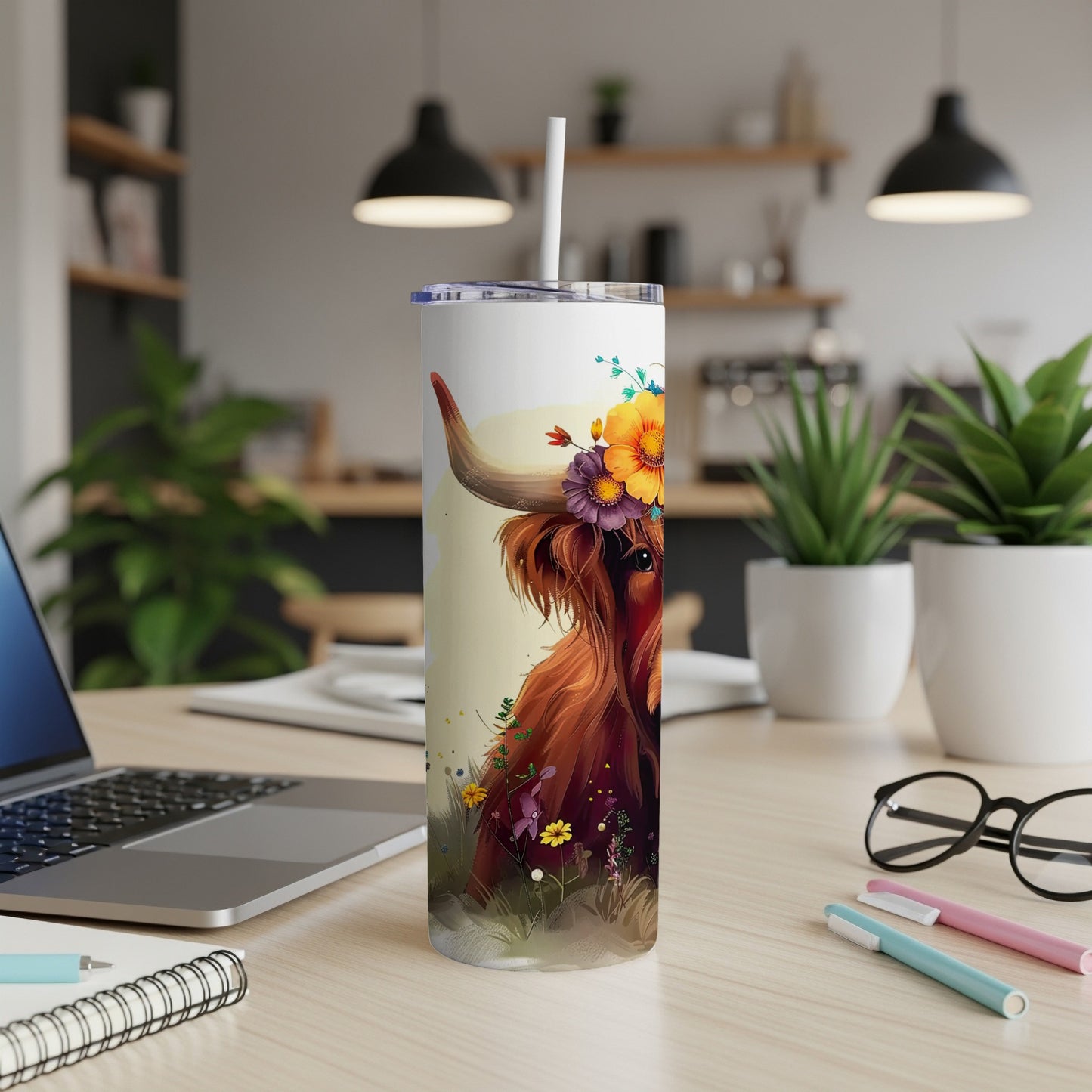 Highland cow with floral crown on white tumbler.