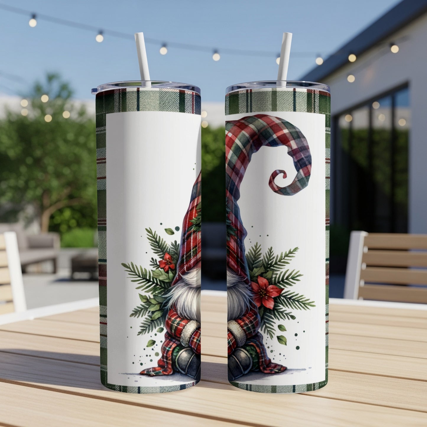 Two tumblers with a Christmas gnome and plaid pattern on a table.