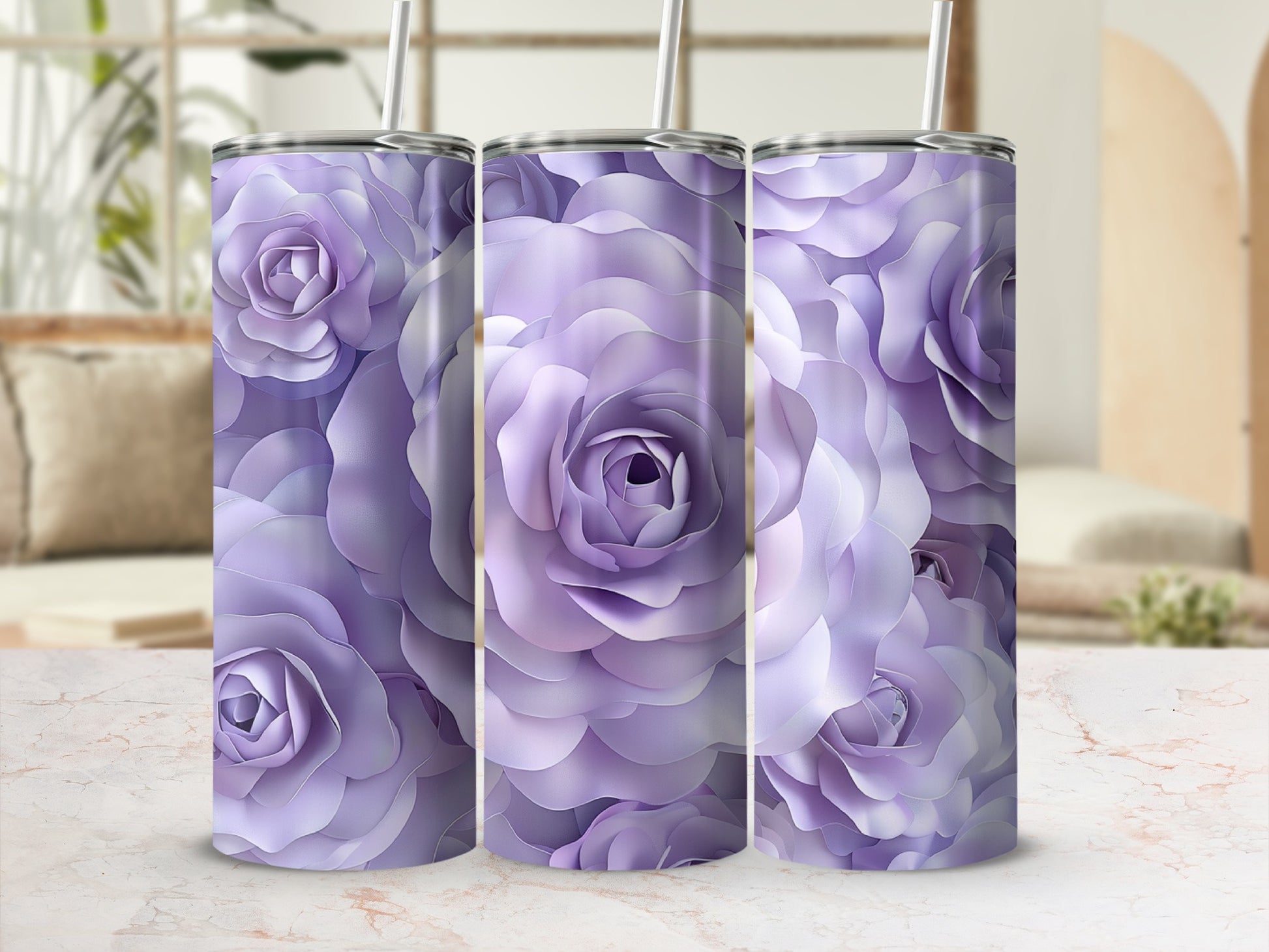 Three purple rose patterned tumblers with straws on a marble surface.