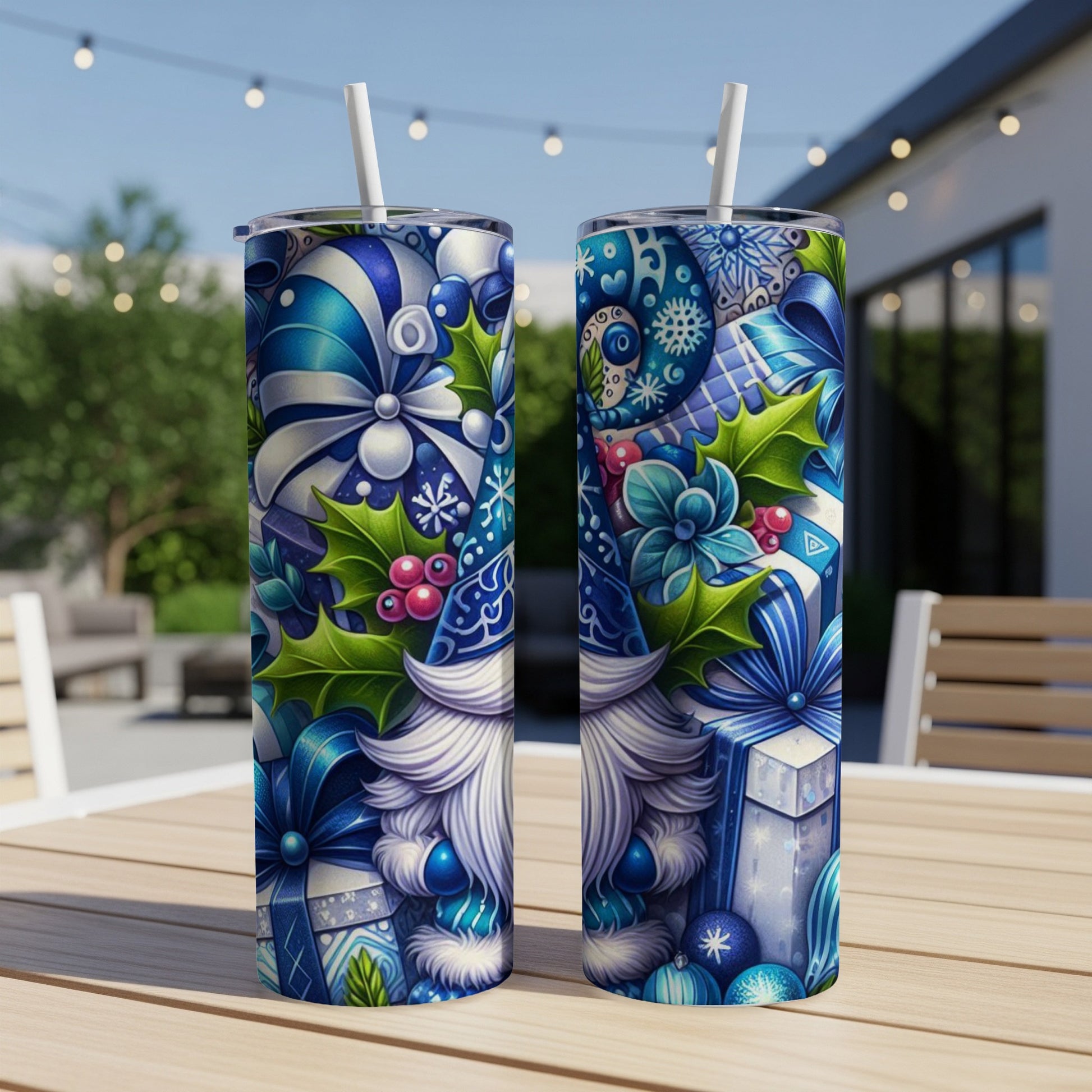 Two blue and white Christmas gnome tumblers with festive winter designs.