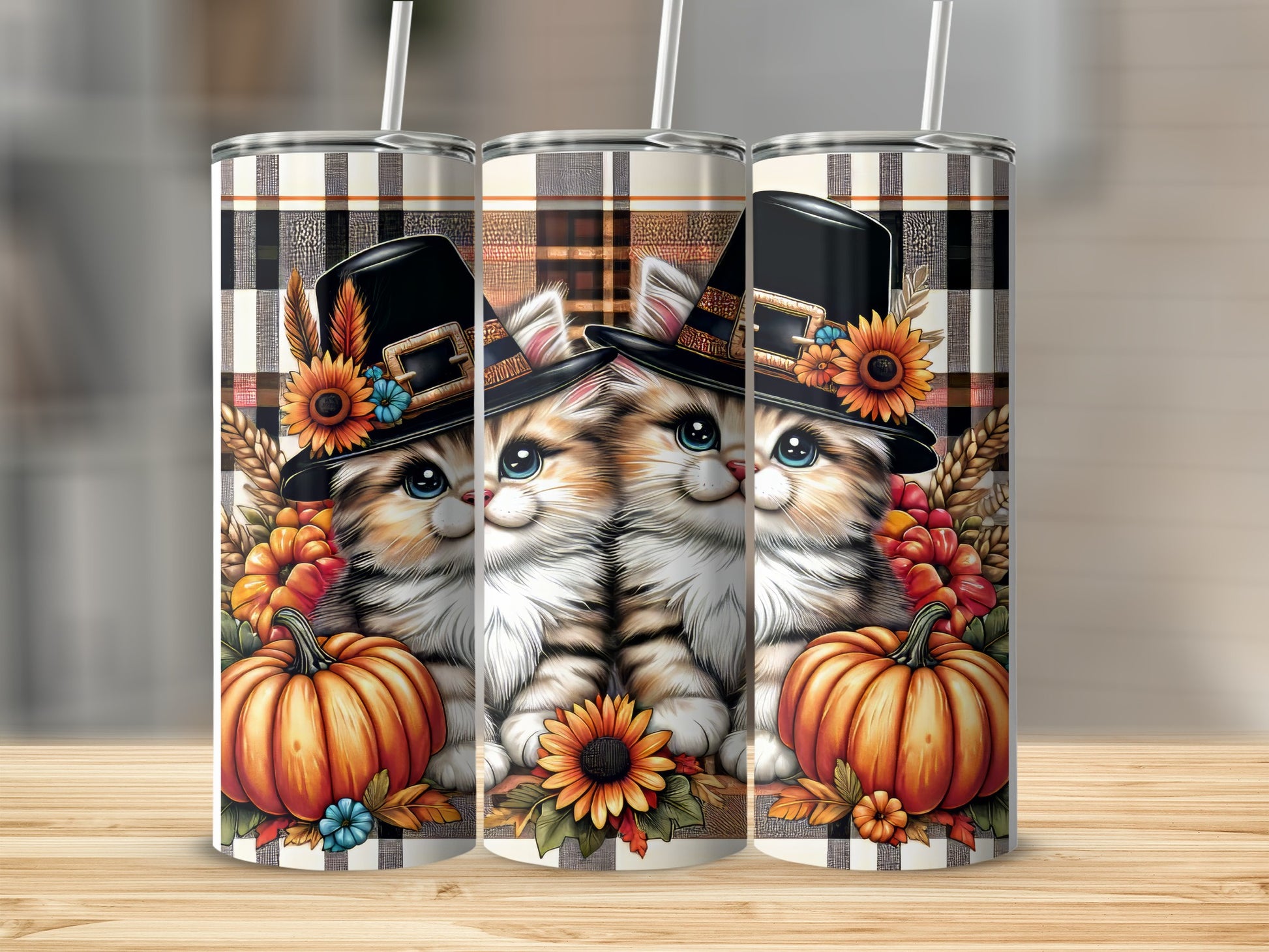 Two tabby kittens wearing pilgrim hats with pumpkins and sunflowers.