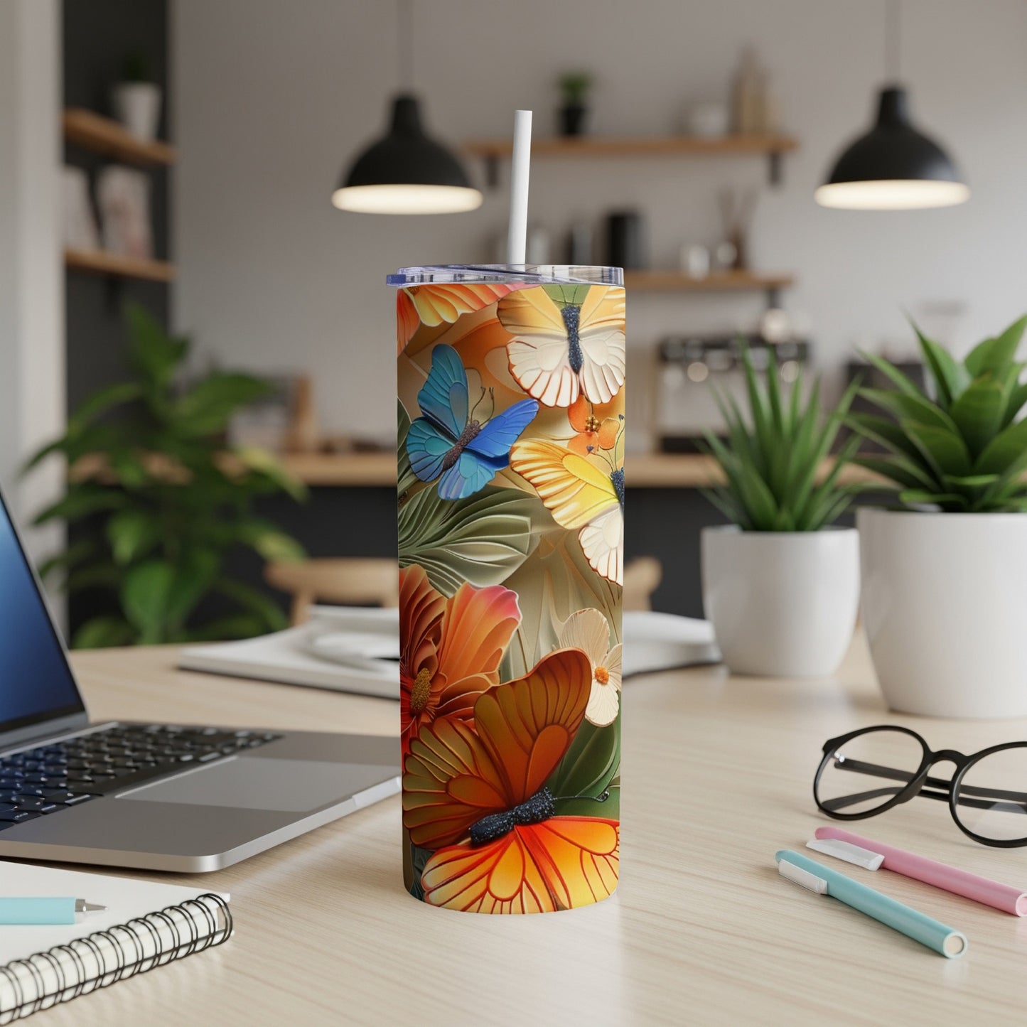 Tall tumbler with vibrant butterflies and floral design.