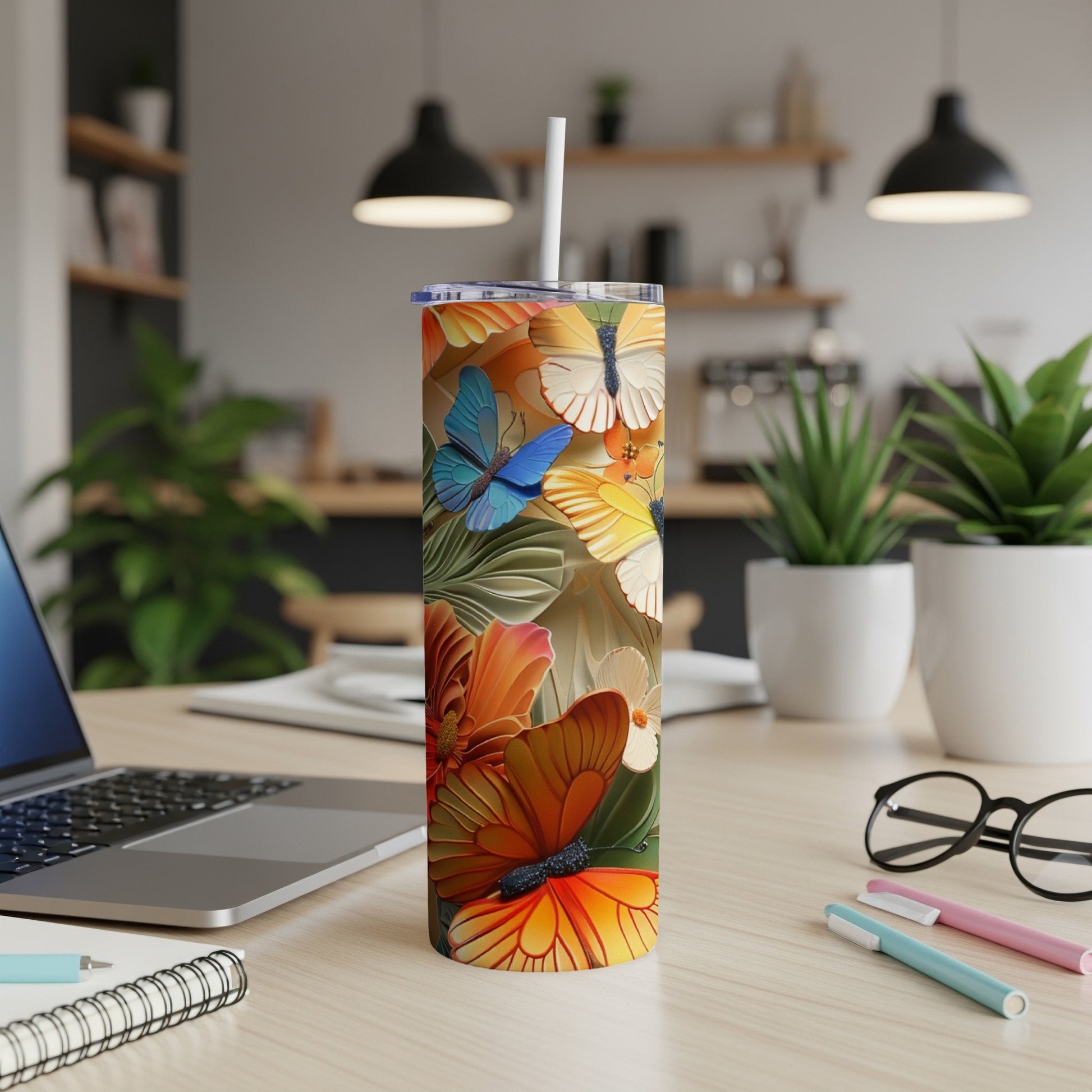 Tall tumbler with vibrant butterflies and floral design.