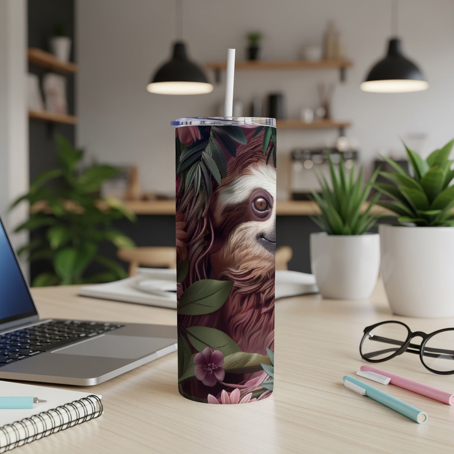 Sloth illustration on a white tumbler with tropical leaves and flowers.