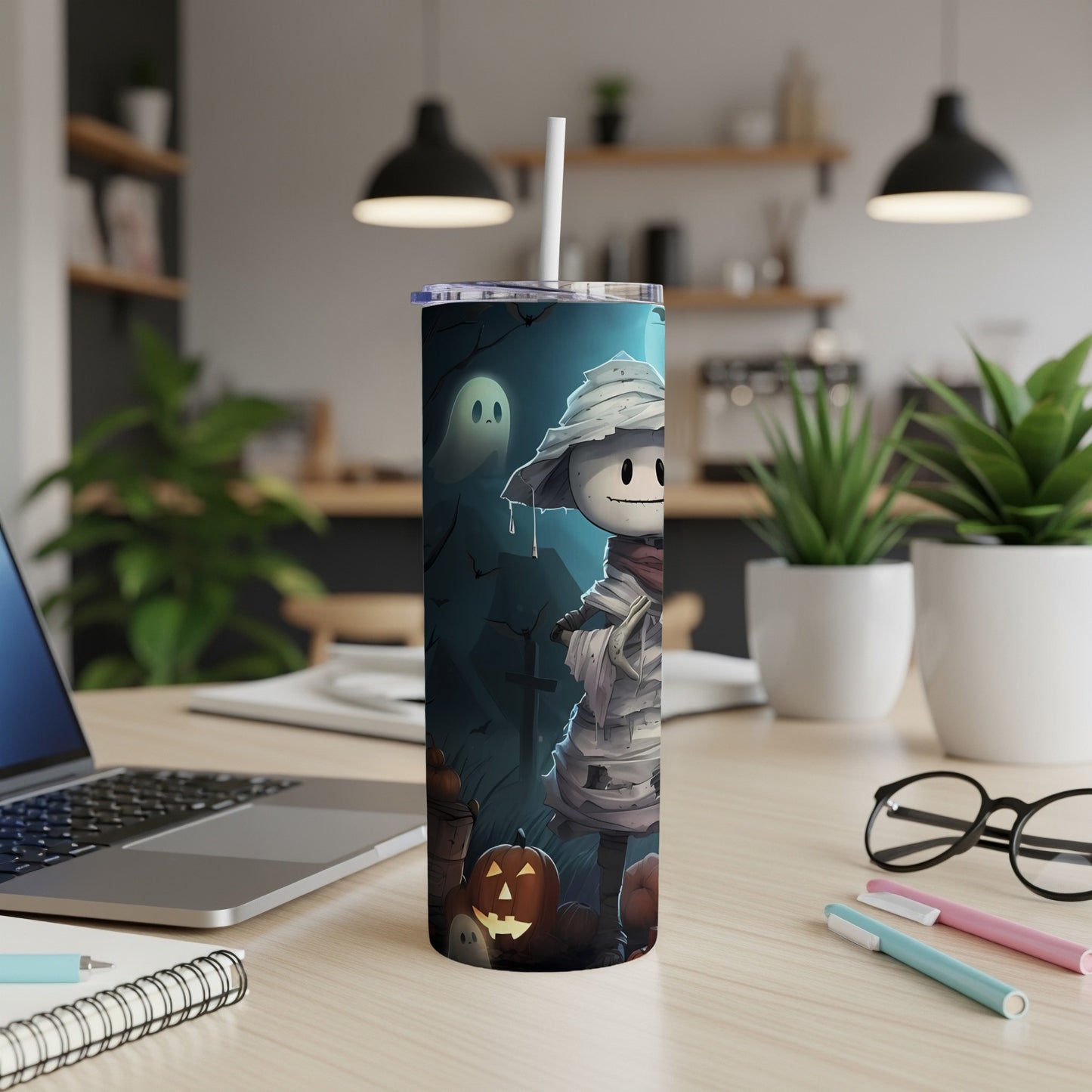 Tumbler with a cute mummy character, ghost, pumpkins, and bats on a dark Halloween background.