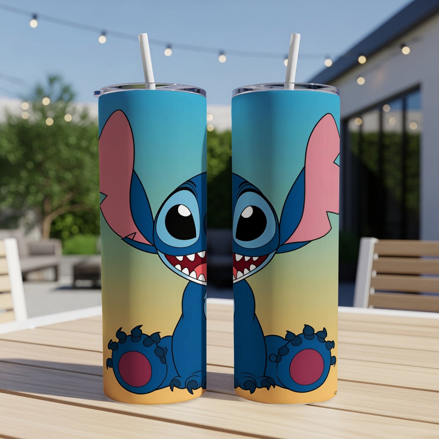 Two Stitch character tumblers on a table with a blurred outdoor background.