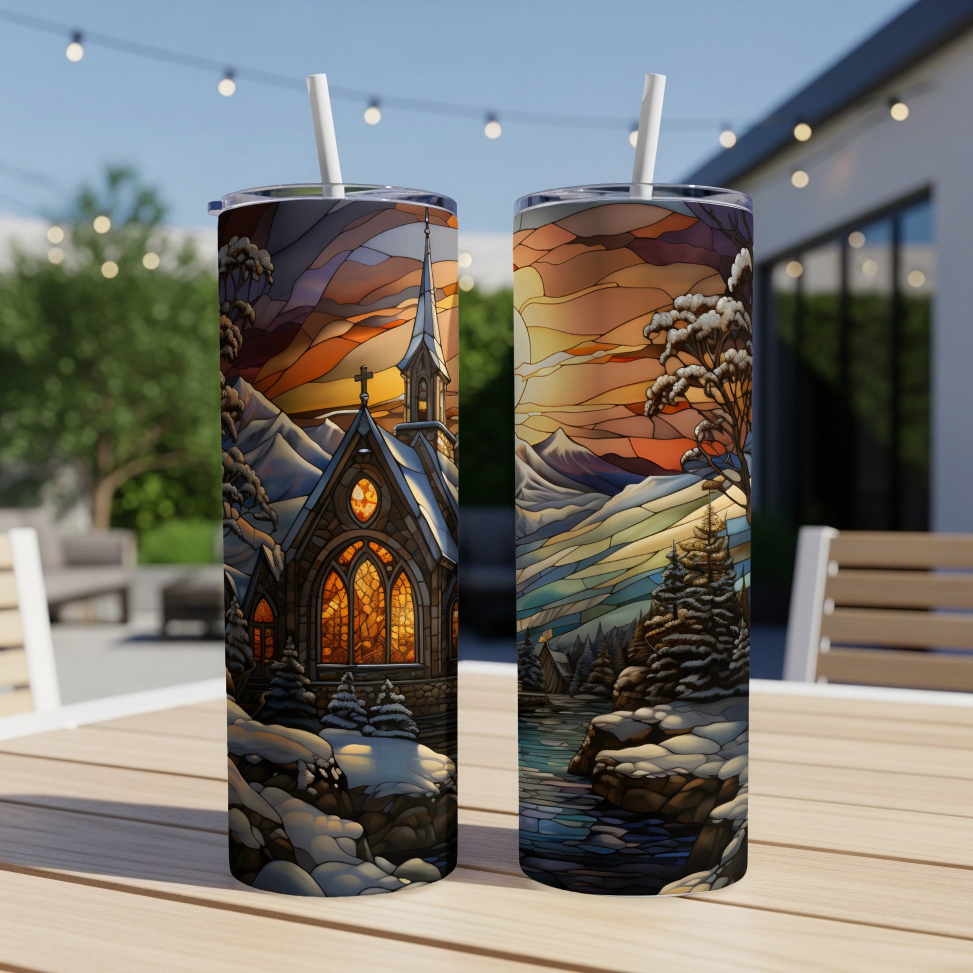 Two stained-glass art tumblers depicting a church and winter landscape scenes.