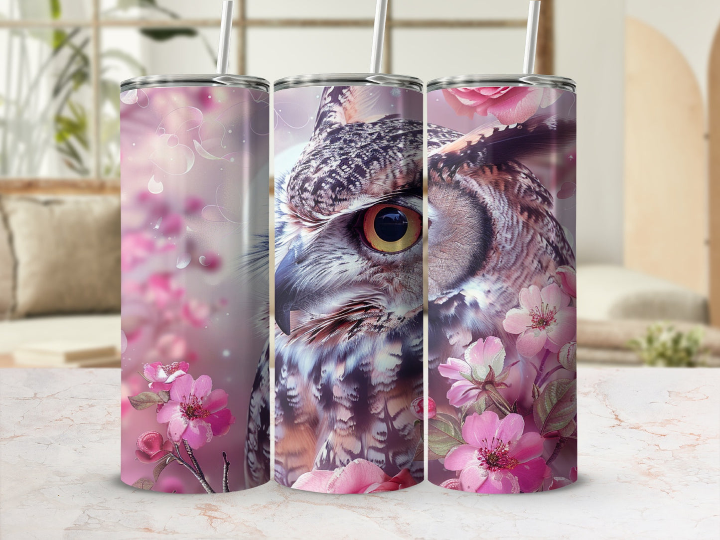 Owl with pink flowers on a skinny tumbler.