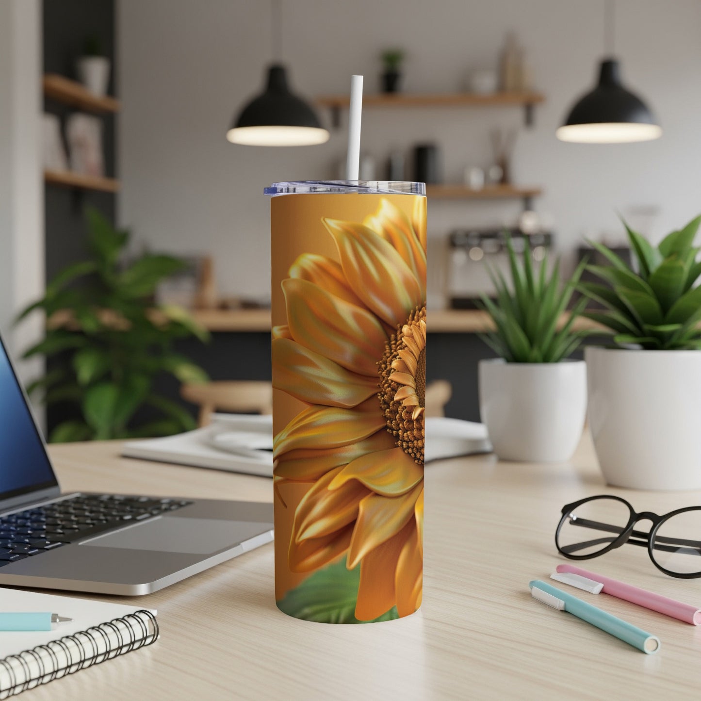 Orange sunflower design on a tall tumbler with a straw.