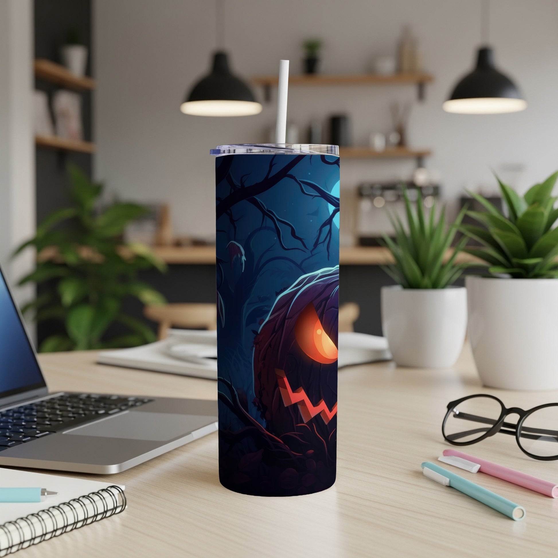 Tall tumbler with a spooky Halloween jack-o'-lantern and forest design.