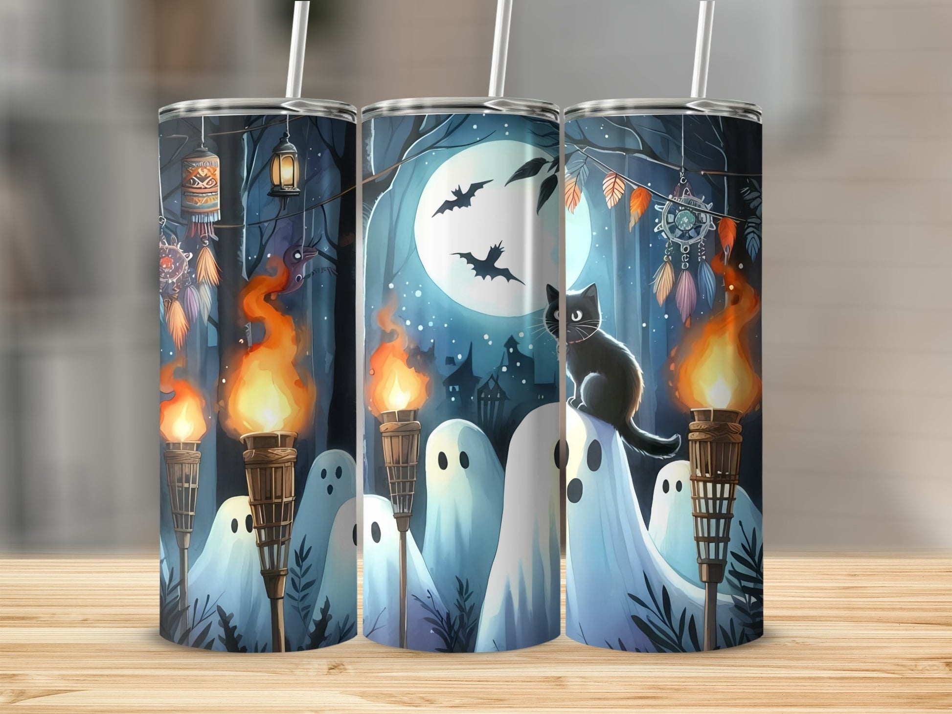 Halloween tumbler with black cat, ghosts, torches, and a full moon night scene.