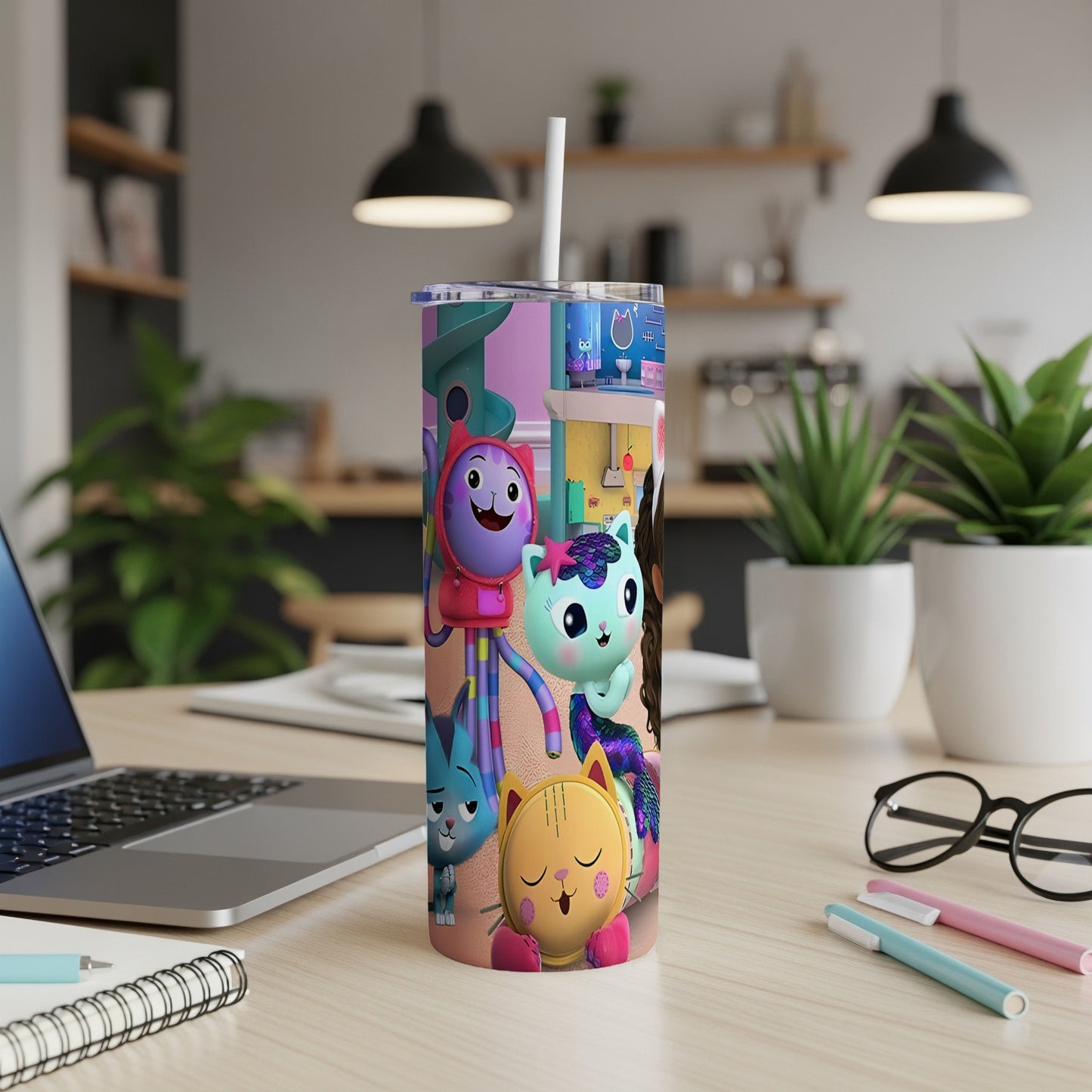 Gabby's Dollhouse characters on a colorful insulated tumbler with straw.