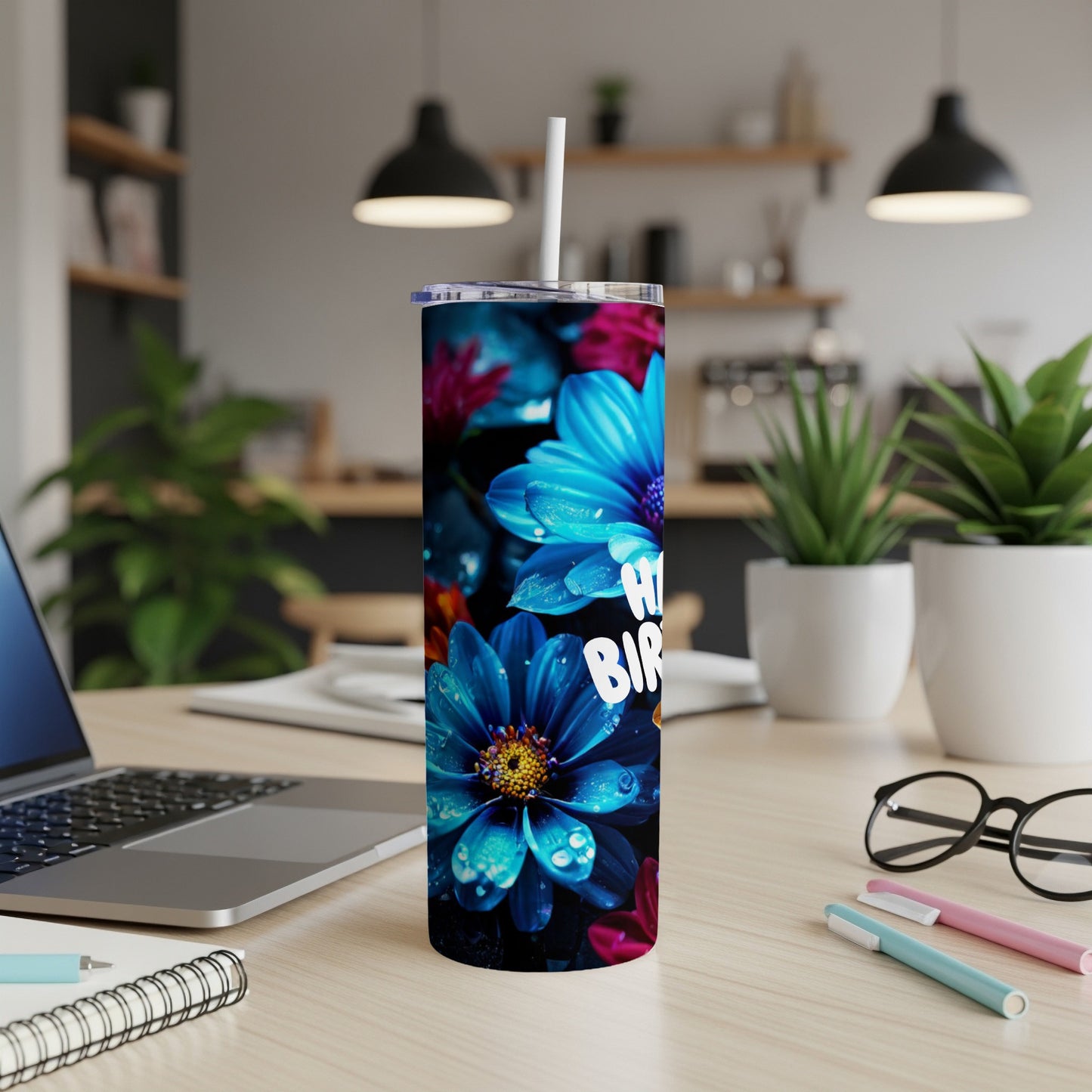 Tumbler with "Happy Birthday" text and vibrant blue and pink flowers.