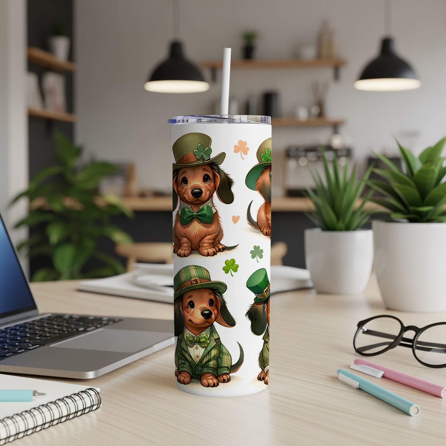 Saint Patrick's Day dachshunds wearing green suits and hats on a tumbler.