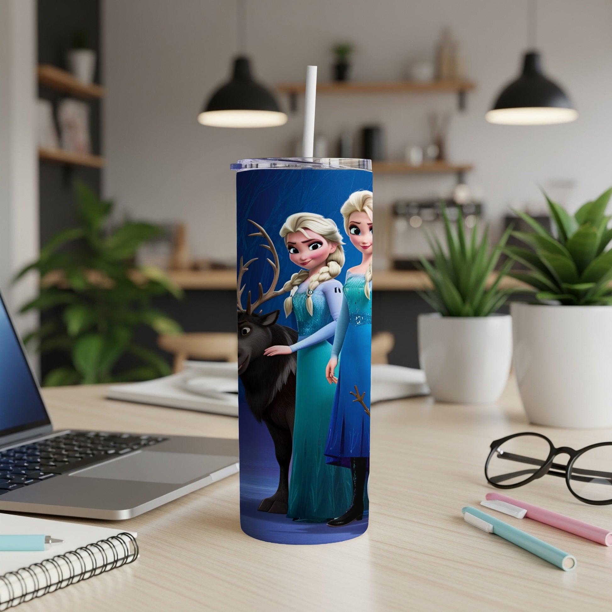 Elsa and Anna from Frozen with Sven the reindeer on a blue patterned tumbler.