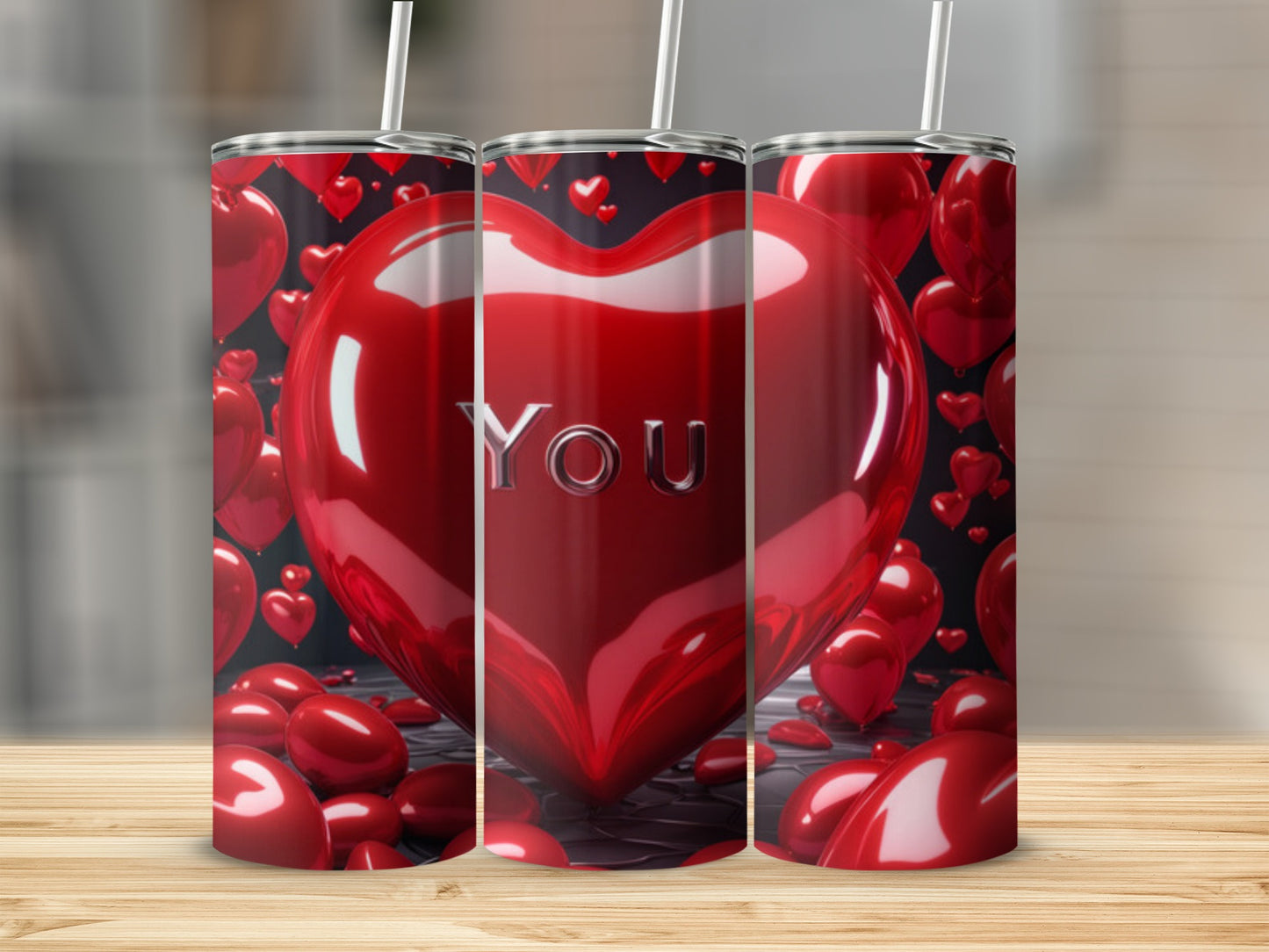 Three red heart-shaped tumblers with straws, displaying "YOU".