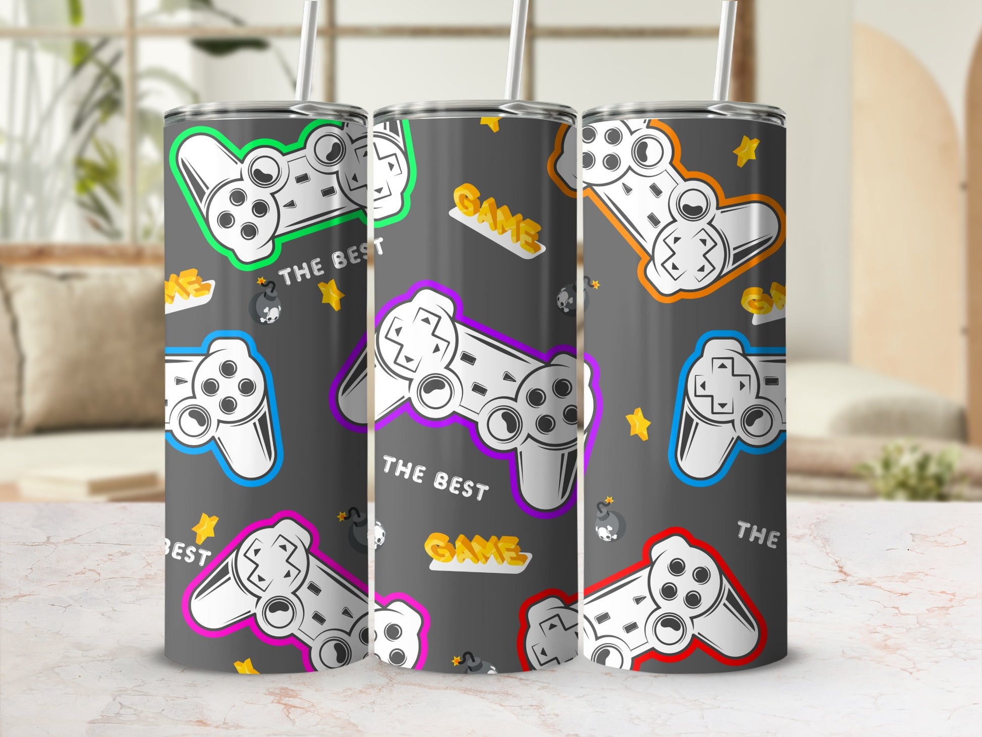Tumblers with video game controllers and the words "THE BEST GAME".