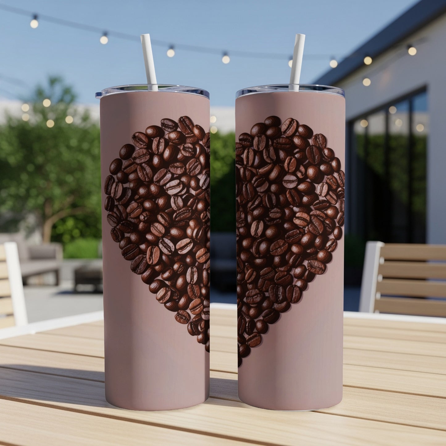 Two tall, pink tumblers with a heart made of coffee beans.