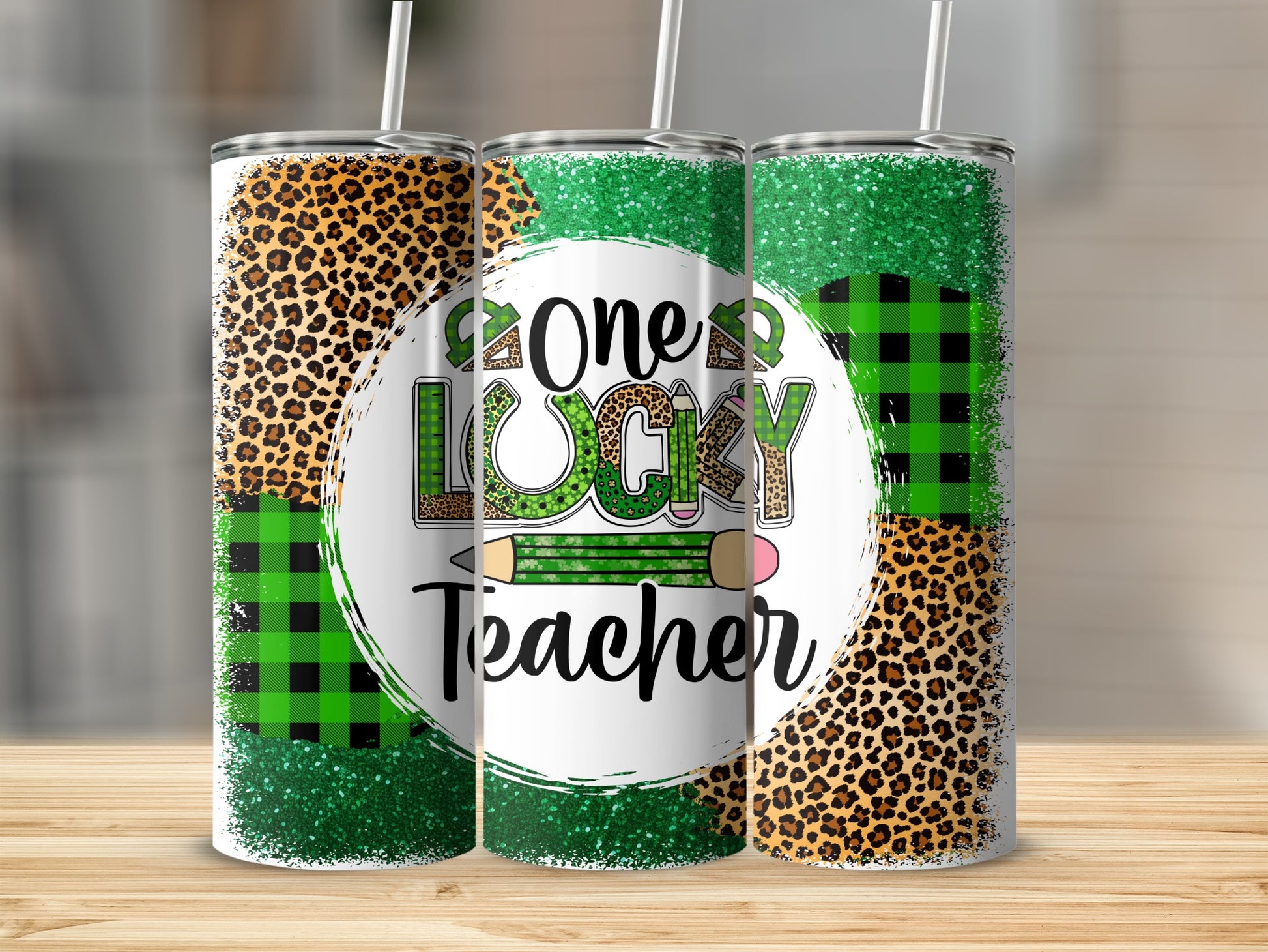 Three tumblers with leopard print, buffalo plaid, and glitter design.