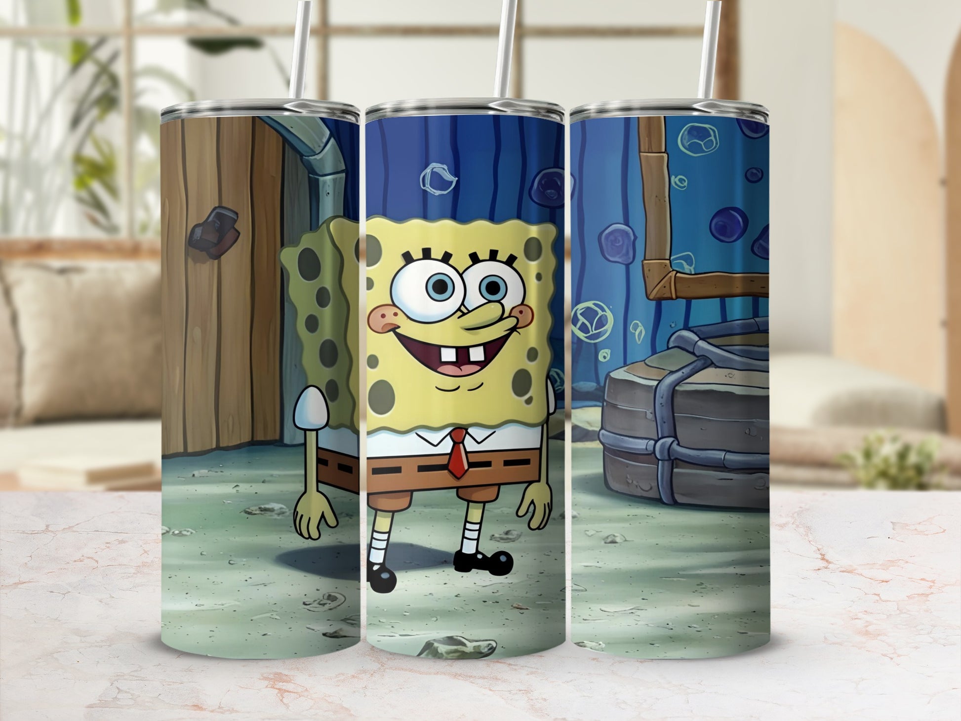 SpongeBob SquarePants character illustration on three cylindrical tumblers.