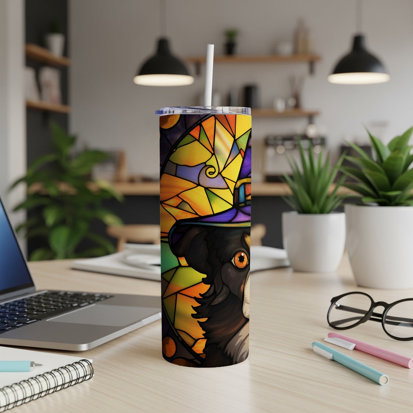 Stained glass tumbler with dog wearing a witch hat.