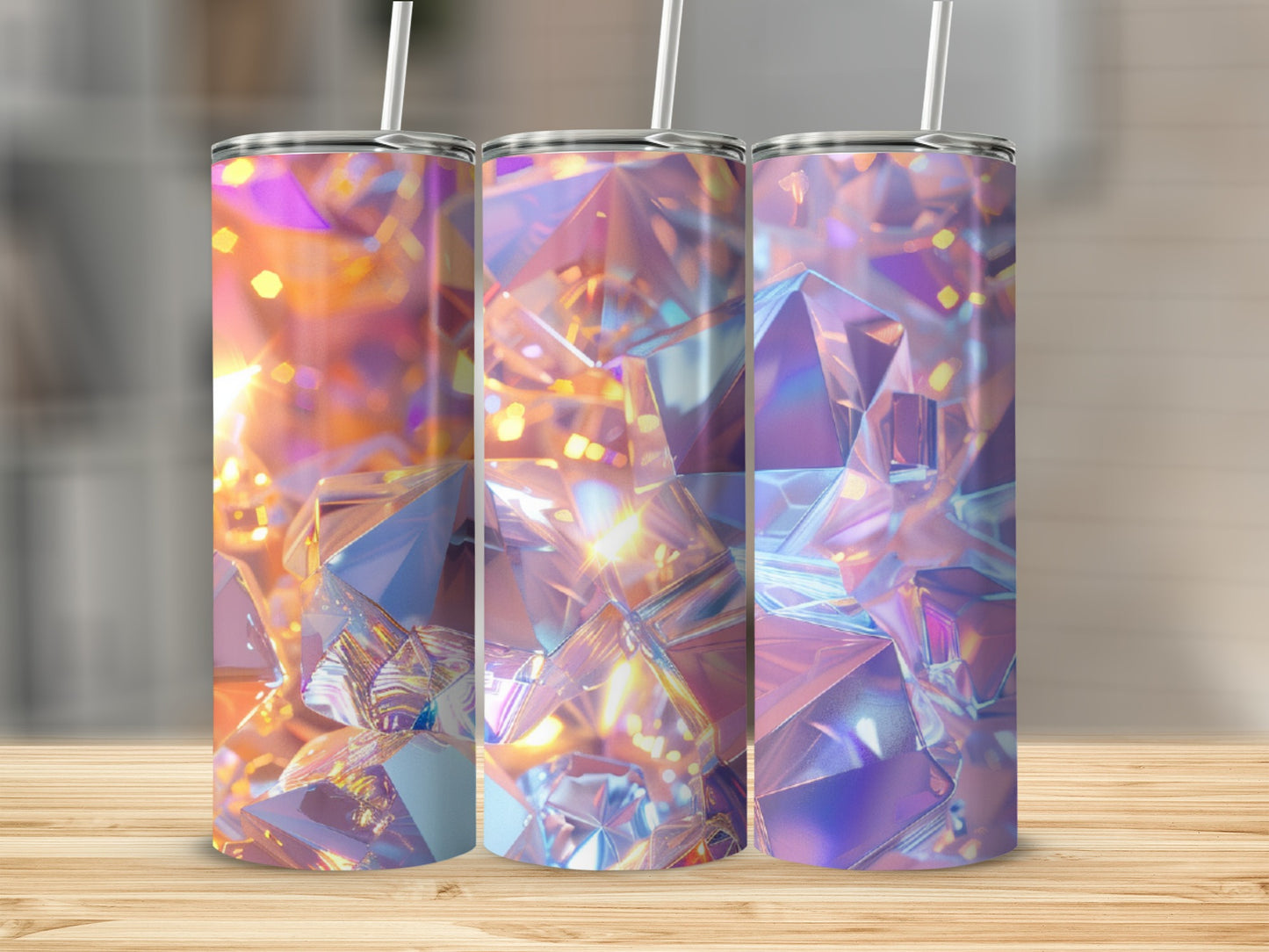 Three tumblers with a faceted, iridescent crystal design on a wooden surface.