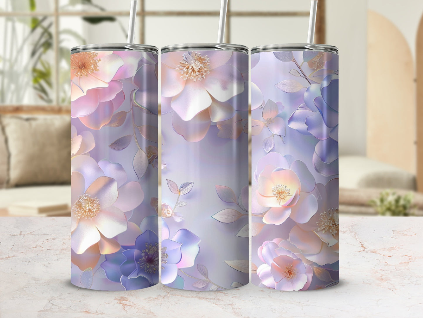 Three tumblers with pastel floral designs in pink, purple, and blue.