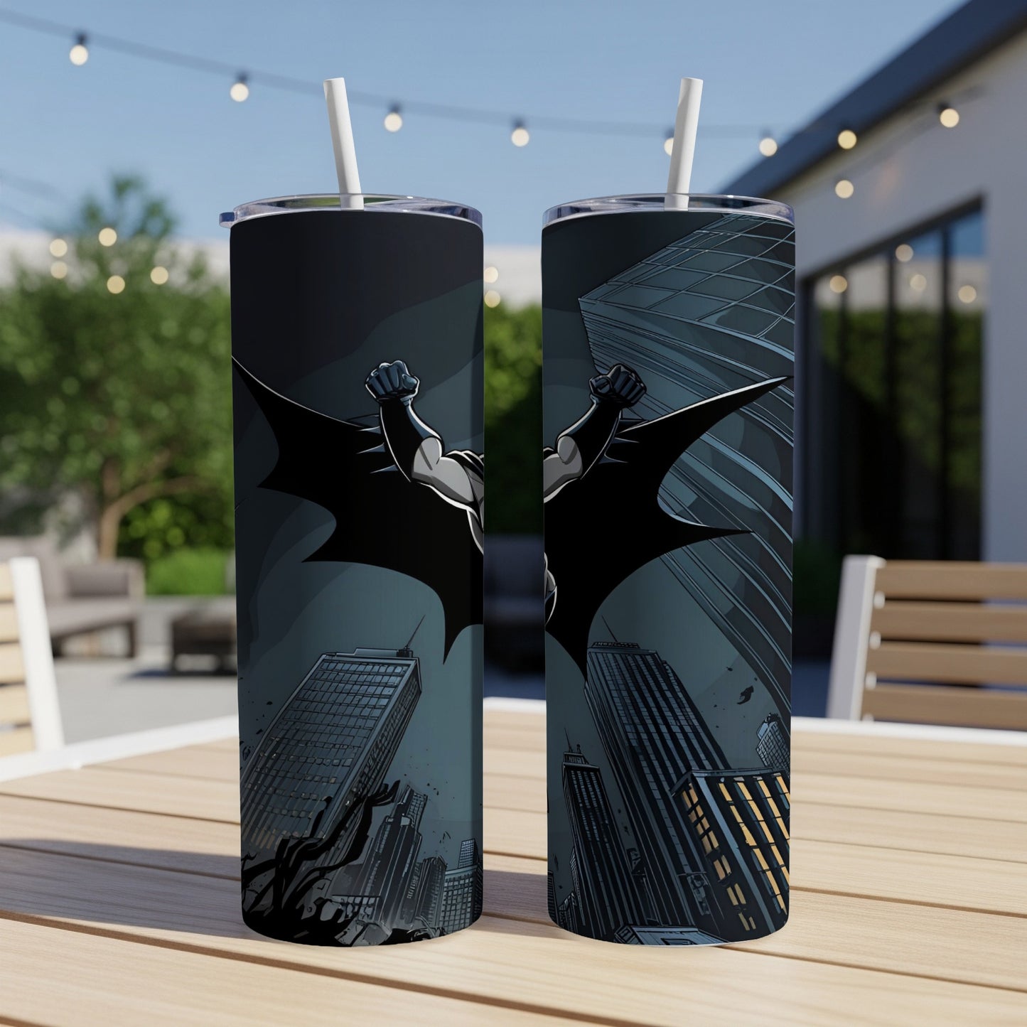 Two tumblers featuring Batman silhouette against a cityscape with skyscrapers.