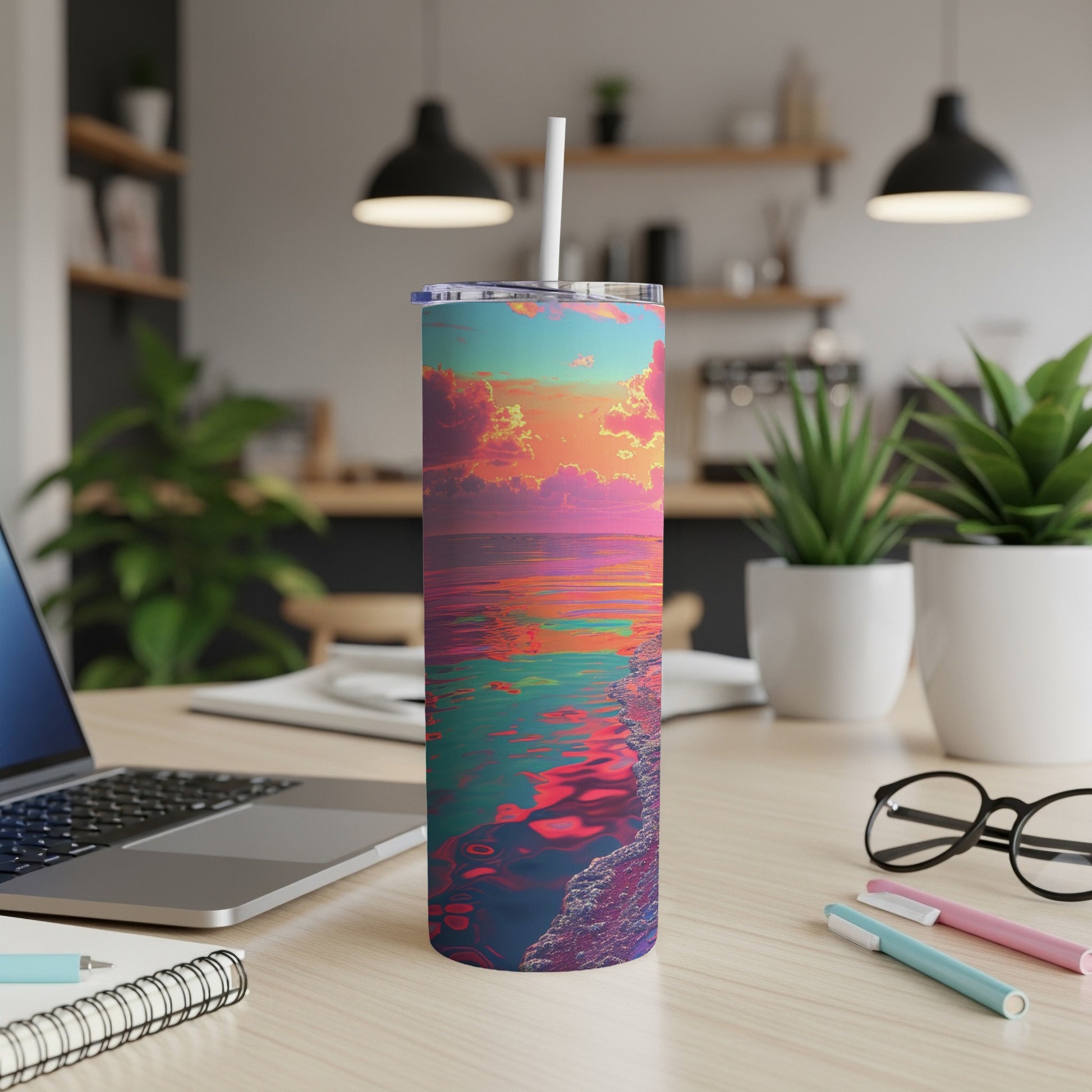 Colorful sunset over water on a skinny tumbler with straw.